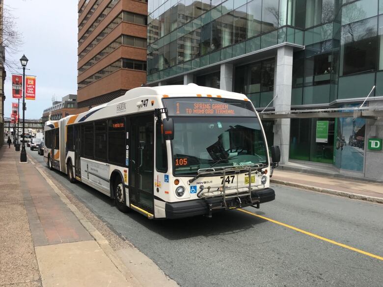 A Halifax Transit bus is driving on the road in Downtown Halifax.