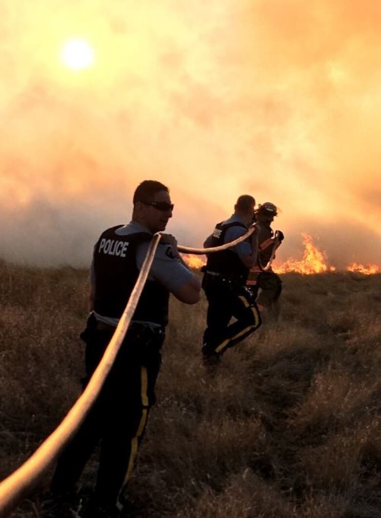 offices trying to extinguish a fire