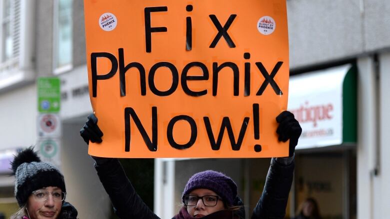 Members of the Public Service Alliance of Canada affected by the Phoenix Pay System rally on Laurier Avenue during a protest on the three year anniversary of the launch of the pay systemon Thursday, Feb. 28, 2019. 