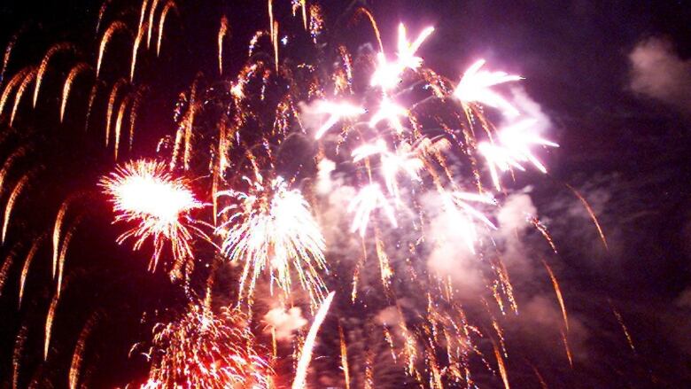 Fireworks over a lake. 