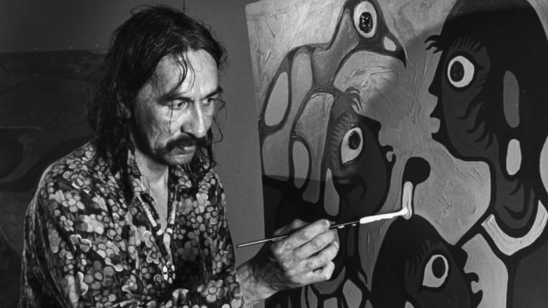 A male artist with long hair is shown painting on July 11, 1979, at a gallery in Kleinberg, Ont.