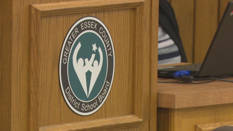 A podium which features the logo of the Greater Essex County District School Board