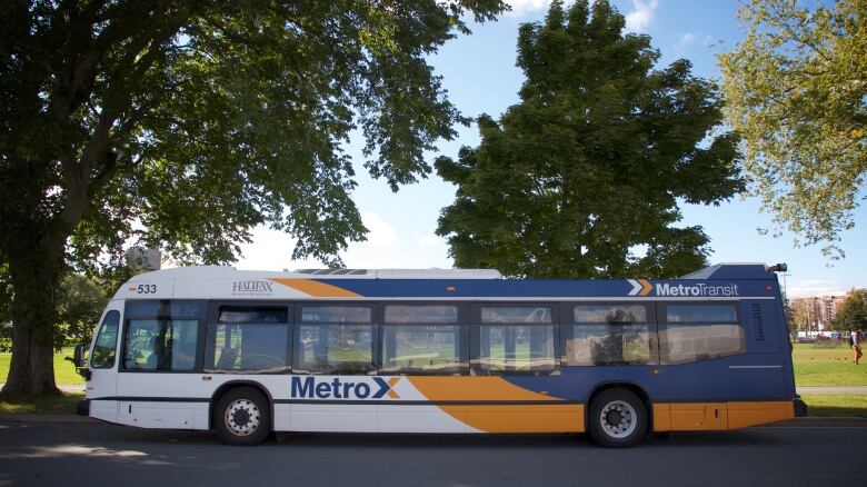 A Halifax Transit bus is parked next to the Halifax Common.