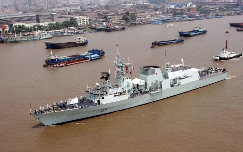 The Canadian Royal Navy ship HMCS Regina cruises in the Huangpu River in Shanghai, China, Tuesday Aug. 15, 2006. The Defence Department says it will extend its participation in a multi-national anti-terrorism patrol in the Arabian Sea to April 2015.