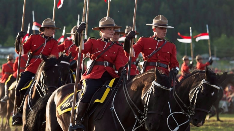 The RCMP Musical Ride performs at an event marking the one-year anniversary of the shooting deaths of Constables David Ross, Fabrice Gevaudan and Doug Larche , in Moncton, N.B. on Thursday, June 4, 2015. Justin Bourque was sentenced to life in prison with no chance of parole for 75 years after pleading guilty to three counts of first-degree murder and two counts of attempted murder.