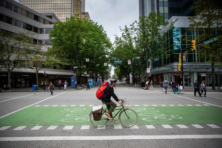 Pedestrians cross in all directions at a new all-walk crosswalk trial at Hornby and Robson in Vancouver, on Thursday, July 4, 2019.