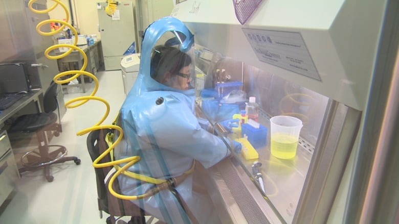 Dr. Xiangguo Qiu, seen here in an undated screengrab from a CBC segment, at the National Microbiology Laboratory (NML) in Winnipeg.