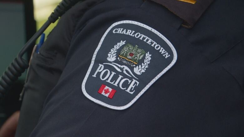 Close up of the shoulder badge of a Charlottetown police officer.