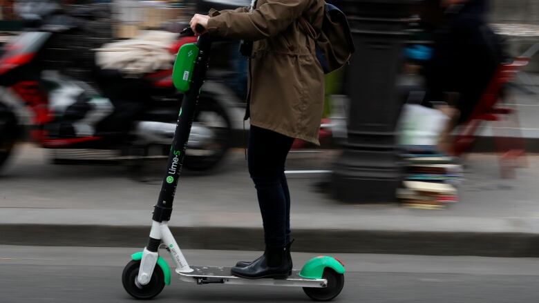 A woman on an electric scooter