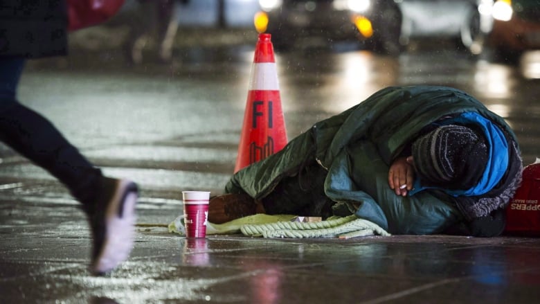 A homeless person is seen in downtown Toronto