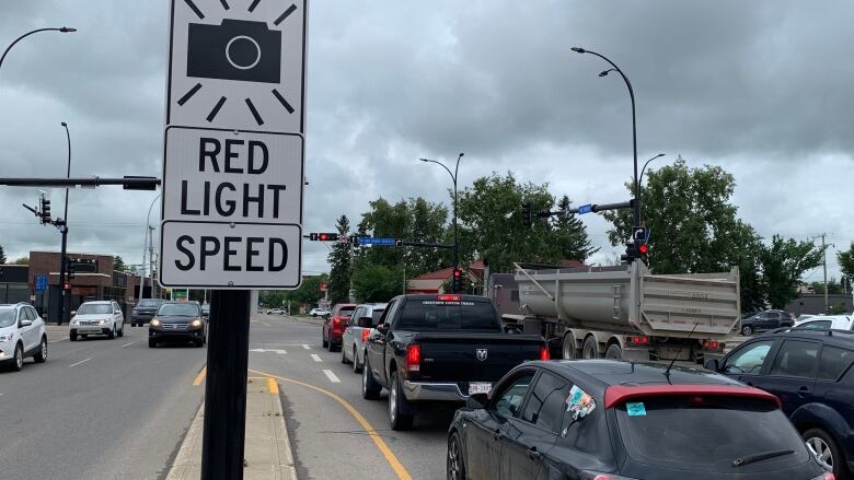 A sign marks that a red-light camera is ahead. 