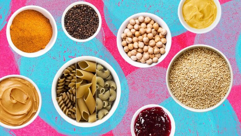 Collage of white bowls of pantry ingredients such as peanut butter, jam, dried pasta and spices all cut out and put on a vibrant blue and pink abstract background. 