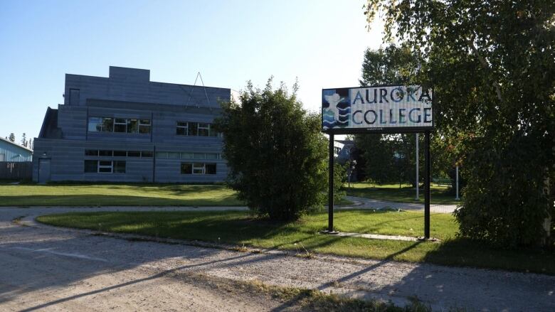 Building with sign that reads 'Aurora College'.