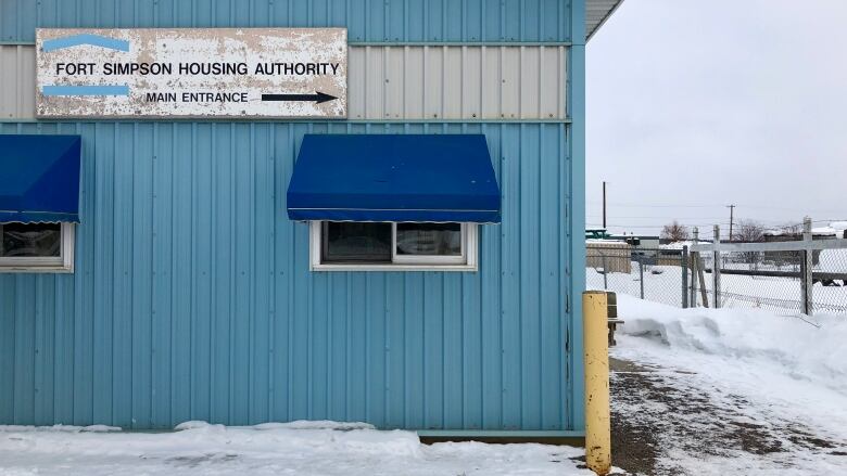 A blue building with a sign that says Fort Simpson Housing Authority 