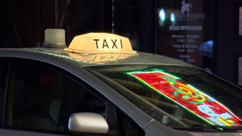 Close-up of a taxi light on a car.