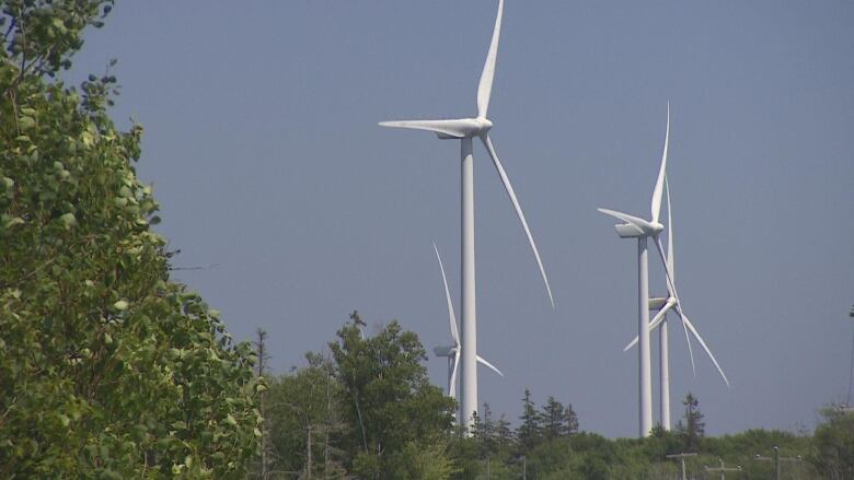 Wind turbines against a blue sky. 