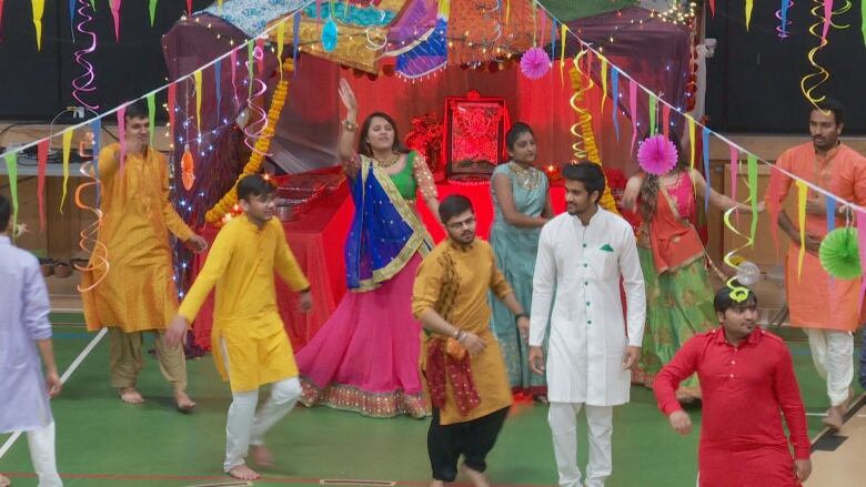 South Asian newcomers to P.E.I. celebrate Navrati in 2019, dressed in brightly coloured clothing. 