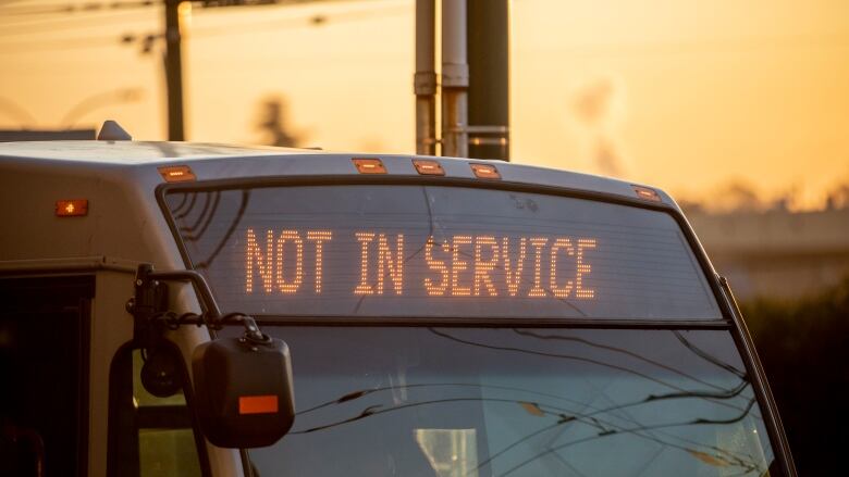 A close-up of the front of a bus with the sign saying 