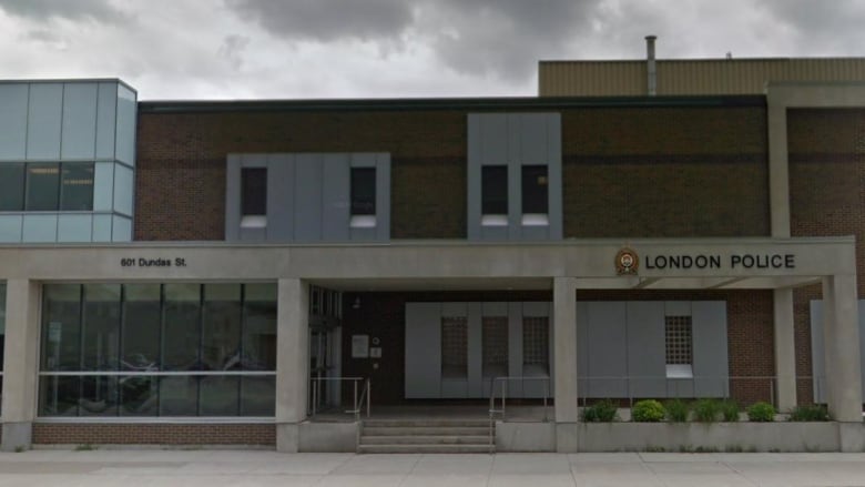 a moody shot of the london police station in London, ONtario. Clouds overhead. 