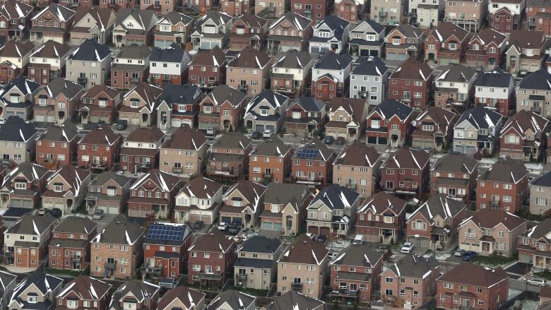 Rows and rows of houses are shown.