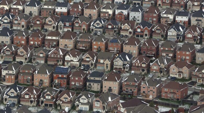 Rows and rows of houses are shown.