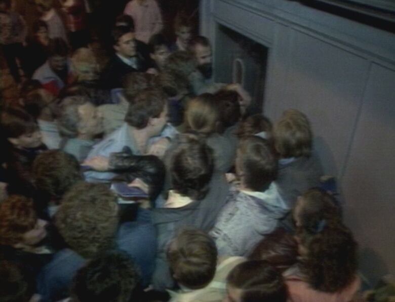 Crowd of people around a checkpoint window