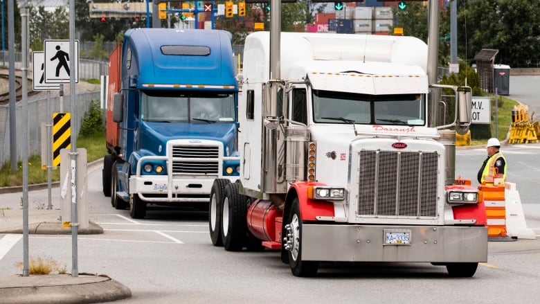 Container transport trucks at entrance of  Port Metros Port of Vancouver in Vancouver, British Columbia on Wednesday, May 29, 2019. 