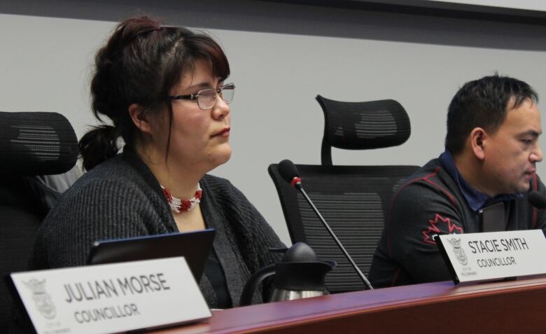 Stacie Arden Smith sitting in Yellowknife city council chambers.