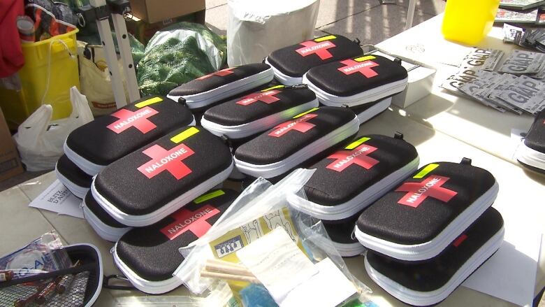 A pile of naloxone kits is seen on a table at the harm reduction organization CACTUS Montral.