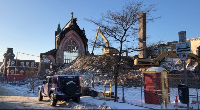 The demolition of an old church on a winter day