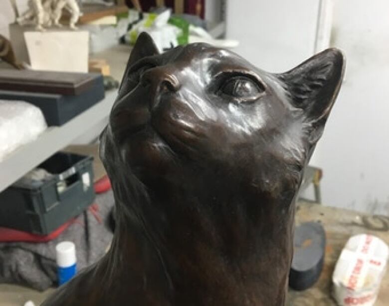 A bronze statue of a cat