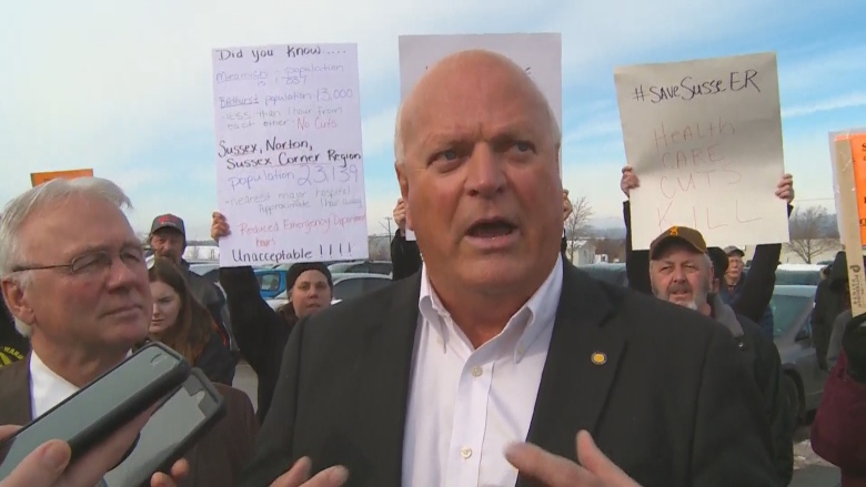 Bruce Northrup speaks among protesters.