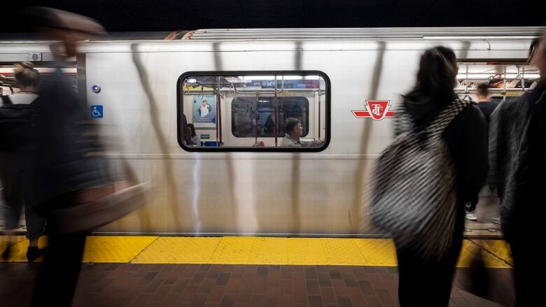 Riders board the TTC subway.