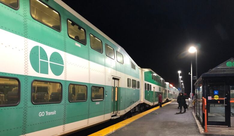 Riders board a GO train at the Acton, Ont., station on Wednesday, January 15, 2020.