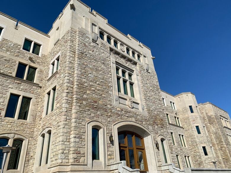 A stone building in the daytime light.