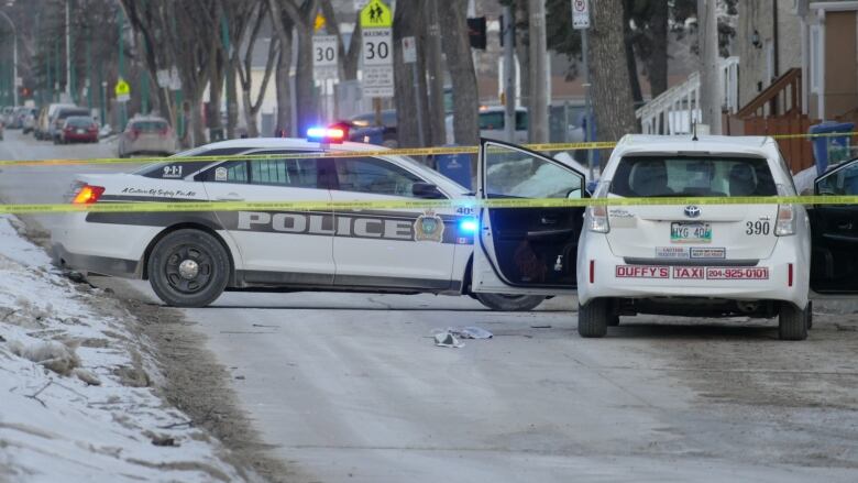 Police cars are pictured at a crime scene.