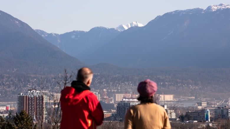 People look at the view from Queen Elizabeth Park in Vancouver on March 18, 2020.