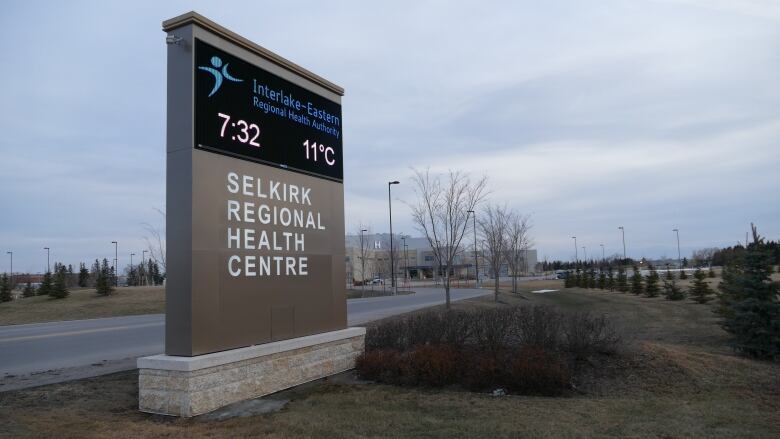 A sign that reads 'Selkirk Regional Health Centre' is seen off the side of the road.