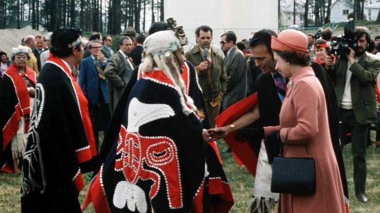 Man in traditional Indigenous cape