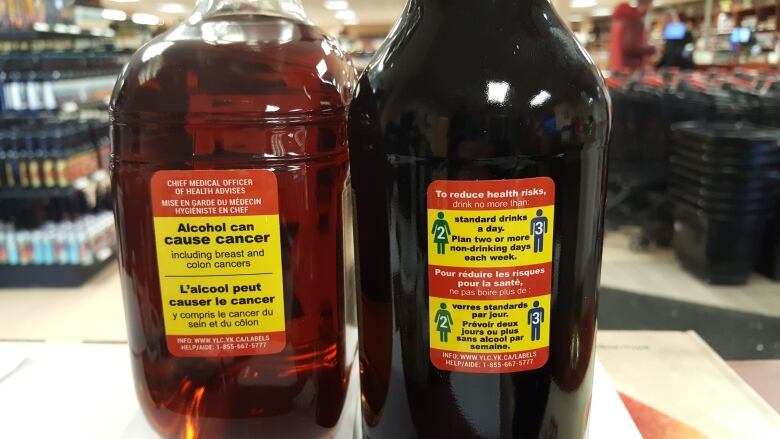 Alcohol bottles with warning labels are pictured at a store in Whitehorse, Yukon.