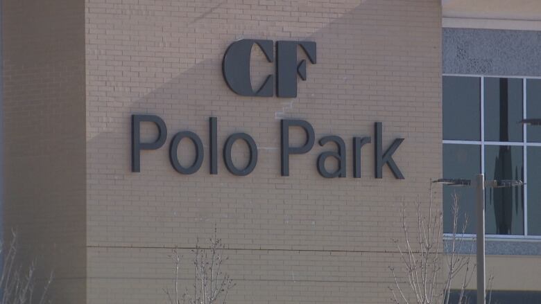 Letters on the side of a mall spell 'CF Polo Park.'