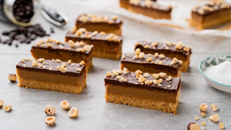 7 Hazelnut Espresso Millionaire Bars sitting on a grey countertop. 