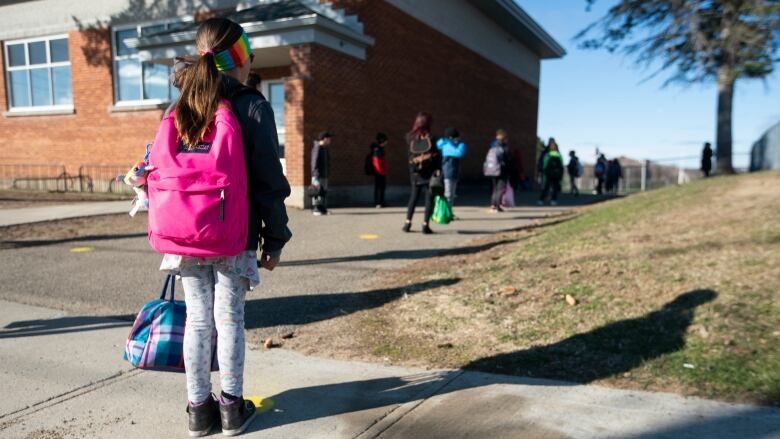 young student outside school