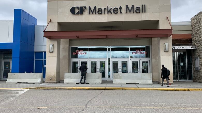 An exterior door which reads Market Mall. 