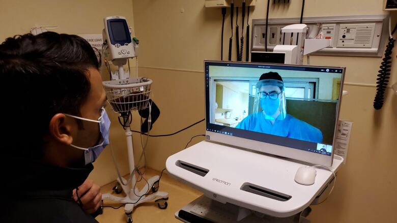 A virtual COVID-19 assessment over a computer.