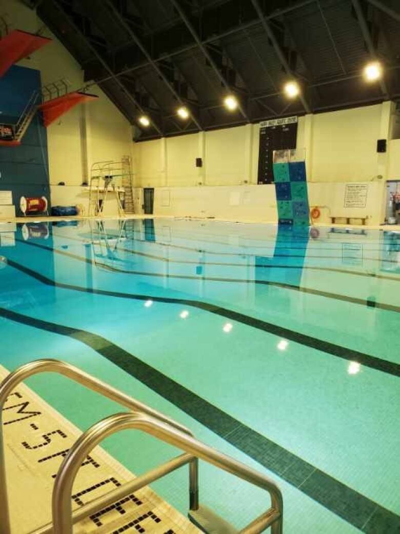 An indoor pool and diving boards.