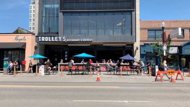 A patio is blocked off with cones. 