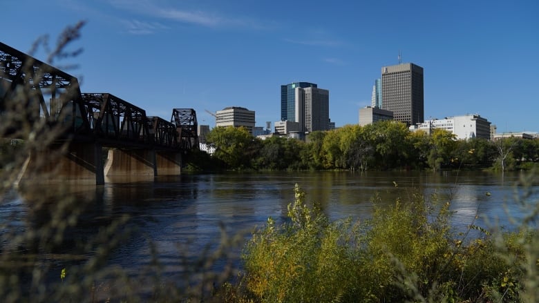 Downtown Winnipegm with the Red River in the foreground.