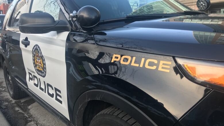 A close-up view of the side of a Calgary police car.