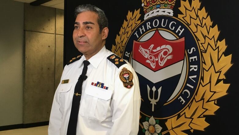 a man standing in front of police seal